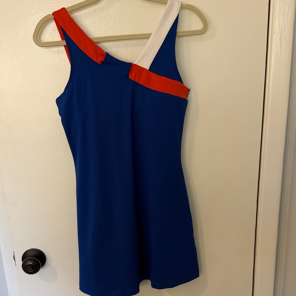blue and orange jersey with a "Tail" brand - athletic dress